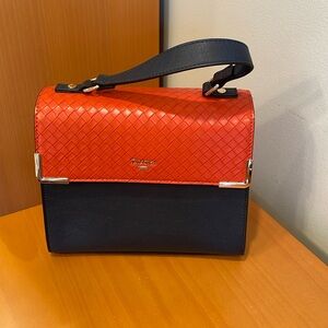 Navy, orange and white top handle satchel